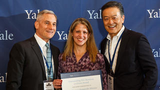 YANA Vice President Lou Martarano ’81 MBA, Executive Director Rachel Litman ’91, and Chair Ken Inadomi '76 accept an Excellence Award during the 2018 YAA Assembly and Yale Alumni Fund Convocation.